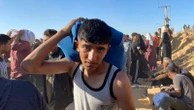 Gazans rush for humanitarian aid as Israeli strikes continue
