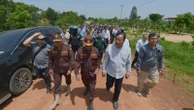 Thailand returns 2 wounded soldiers to Cambodia but continues to hold 18 of their comrades