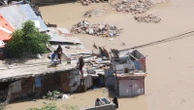 At least seven people die as heavy rains leave waist-high floodwaters in Somalia's capital