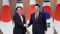 Japan's leader makes farewell visit to South Korea to strengthen his legacy of warming ties