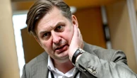 German parliament lifts immunity of far-right lawmaker and police search his home