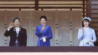 Japan's emperor marks his 65th birthday with a call to keep telling the tragedy of WWII to the young