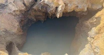 Dừng hút nước, mở rộng phạm vi tìm kiếm nạn nhân mất tích ở 'hố tử thần'