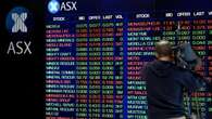 Big banks leading Australian shares higher at midday