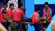 Swimmer collapses on pool deck in Olympic emergency