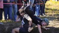 Competitors vie for beer in wife-carrying championship