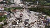 Bosnian villagers sift through flood-ruined homes