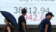 Most Asia shares holding, Japan rate fears dent Nikkei