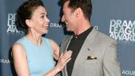 Hugh Jackman and Sutton Foster pictured holding hands