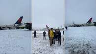 Plane issues: Delta plane evacuates by emergency slides