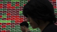Stocks, dollar stay calm in Asia as oil rises