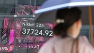 Asian stocks up as Trump calls for Tehran evacuation