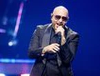 Pitbull says fans wearing bald caps to his concerts proves it's 'deeper than just music'