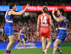 Dogs celebrate Bont milestone with tense win over Swans