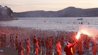 Wild scenes as hundreds run naked to water
