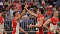 Swans crush mourning Dockers on day of sadness