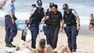 Lewd-photo accused banned from beaches