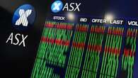 Australian shares flat as miners gain, banks drag