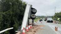 Man’s escape as truck dangles off bridge