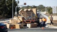 breakingFridges fall off back of truck, block entry to major freeway