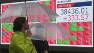 Asian shares higher, dollar flat before Europe outlook