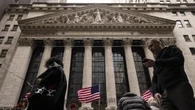 Wall St advances after Fed hints at rate cuts