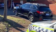 Man shot dead after opening front door