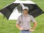 McIlroy leads as bad weather halts The Players