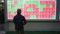 Asian shares wary, dollar upbeat before data deluge