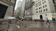 Wall St edges lower as volatile week draws to a close