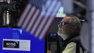 Wall Street futures, dollar ease in wake of credit blow