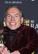 Warwick Davis remembers 'leader of the army' Val Kilmer