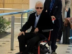 Frail Paul Hogan spotted in wheelchair at Aussie airport