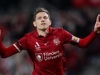 'Unfinished business': Socceroos star seals Reds return