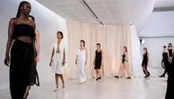 Designer brings beach to the runway in playful show