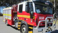 Emergency services attending chemical spill from rollover