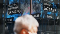 Japanese stocks jump, dollar firms on trade hopes