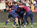 Barcelona down Real 4-3 in Clasico to home in on title