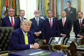 Trump invokes Defense Production Act to keep U.S. coal plants running