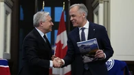 Liberals, Conservatives haggle over a deficit that is both smaller and larger