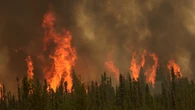 Rain gives some crews a break, but Prairie wildfires keep growing
