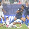 Mbappe's 2 goals help France cruise past Iraq in match prolonged by 2-hour weather delay