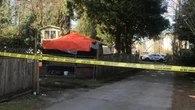 Hostage was lying on top of captor before police opened fire, officer tells B.C. inquest