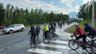 Hundreds take to Alaska Highway in memory of cyclist killed last year
