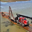 Excavator that fell through ice years ago — and became a landmark — finally pulled out of Sask. lake