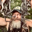 A dead python will get you a free pizza at this man's restaurant. Yes, it's in Florida