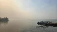 Officials hope natural barriers hold back wildfire near Whatı̀, N.W.T.