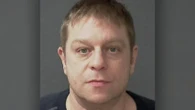 Man who killed star Olympic swimmer charged in multimillion-dollar grandparent scam