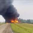 Rail cars carrying ammonia, other hazardous material derail, burst into flame in North Dakota