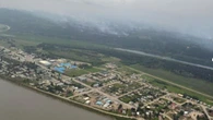 Wildfire near Fort Simpson stays at town's edge as evacuation order continues